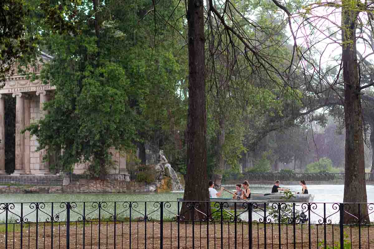Rain pouring down on the Villa Borghese lake in Rome Italy 