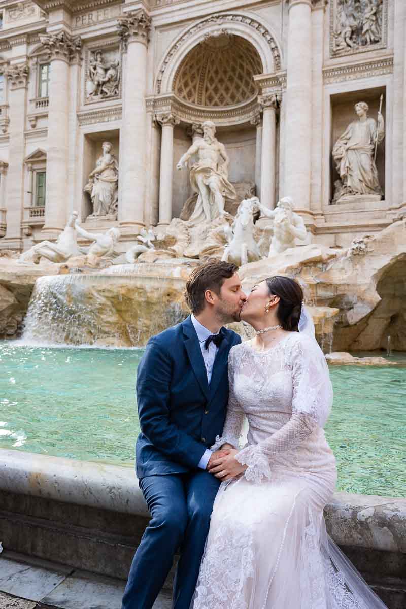 Wedding could kissing at the Trevi fountain 