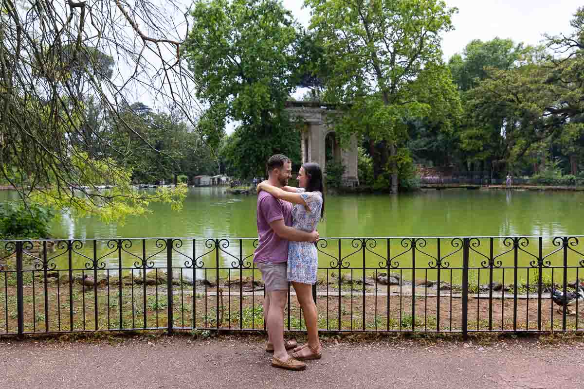 Couple portrait photographed at the lake in Villa Borghese with the Temple in the background 