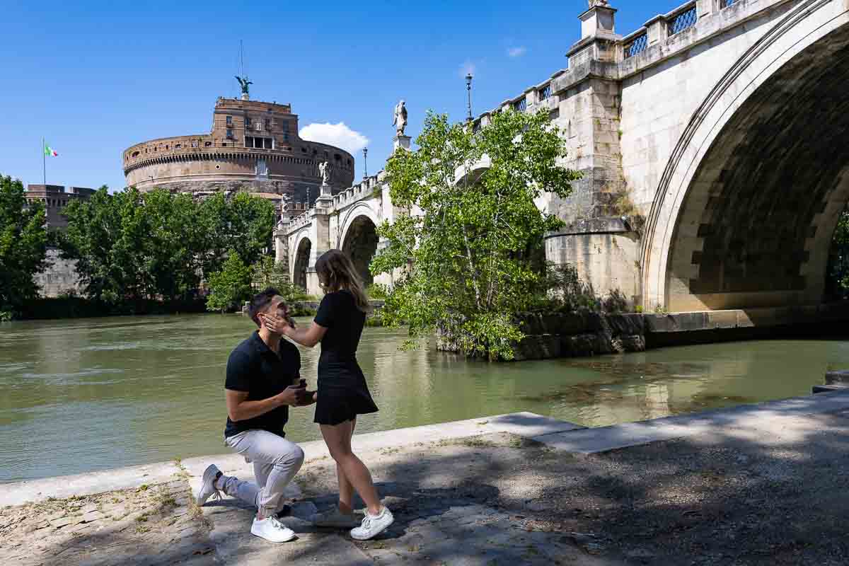 Asking the big question under the castel Sant'Angelo bridge in Rome Italy