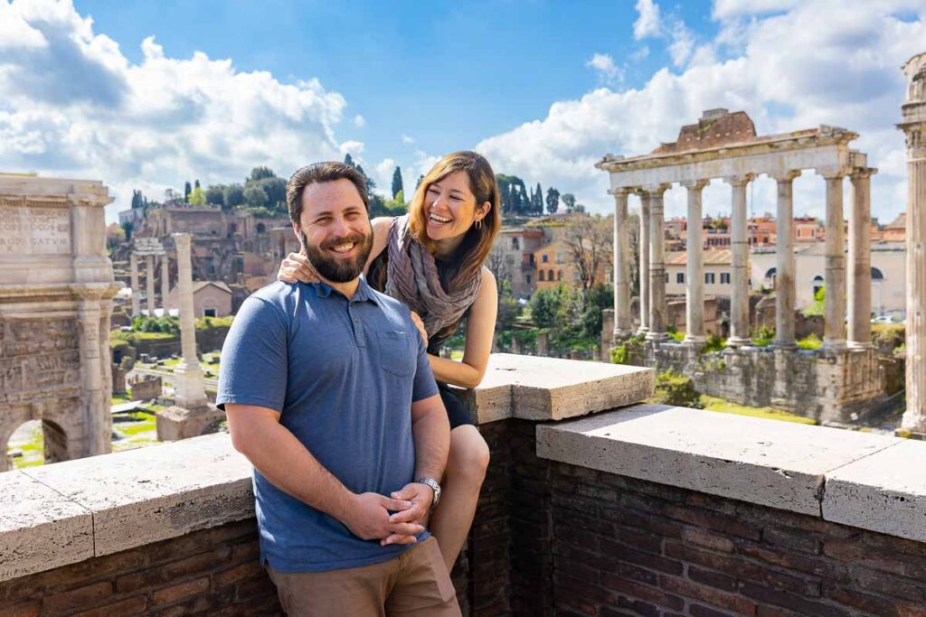 Couple portrait picture taken in front of the roman forum view in the city of Rome