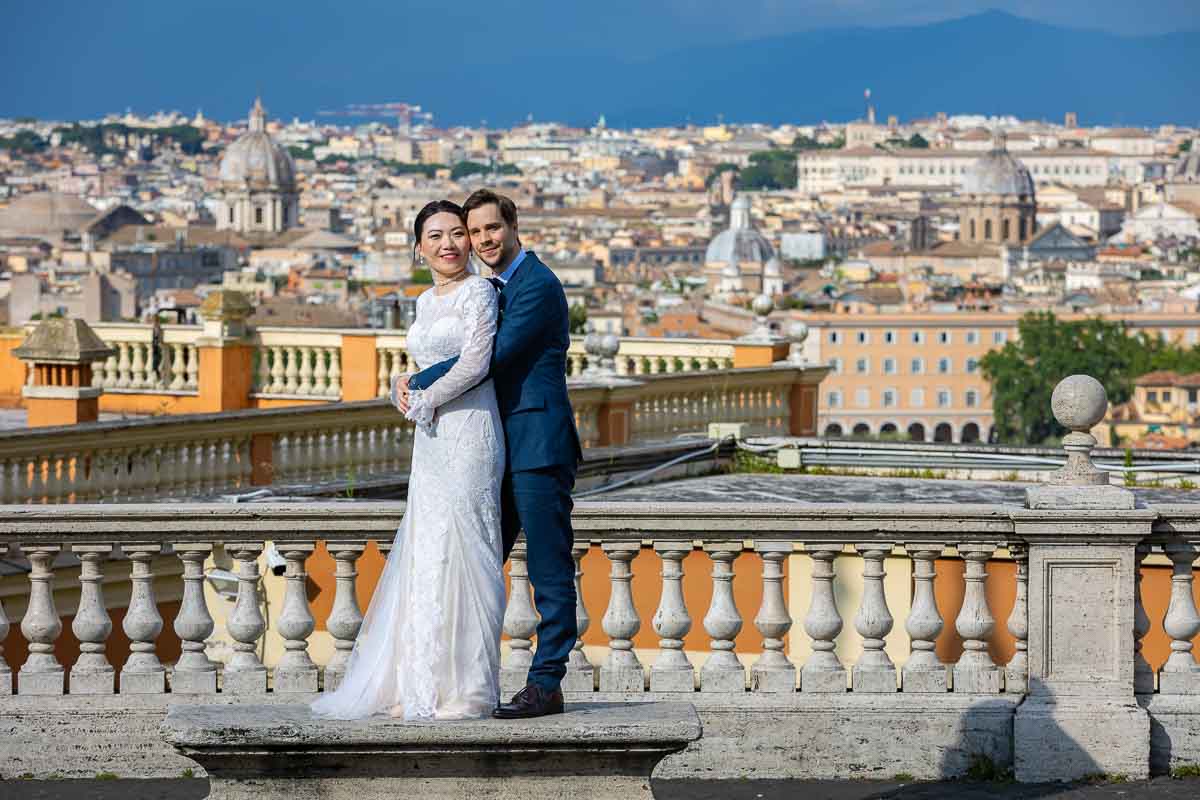 Posed picture of the bride and groom taking wedding photos in Rome