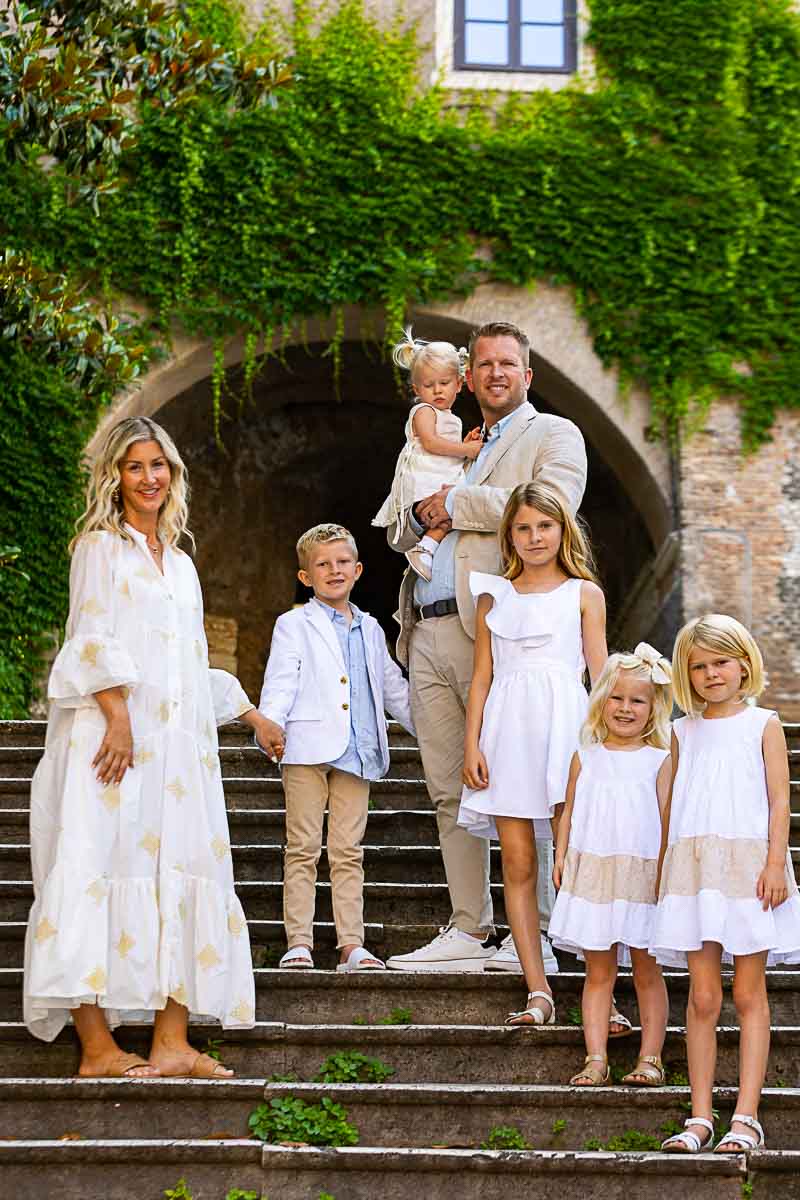 Family portrait taken on the Borgia staircase in the Rome city center 