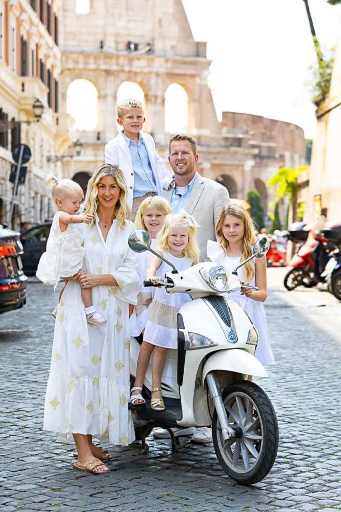 Family photoshoot in Rome Italy photographed on a white piaggio liberty scooter