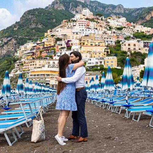 Proposing marriage among typical beach umbrellas found on the beachfront of Positano Italy