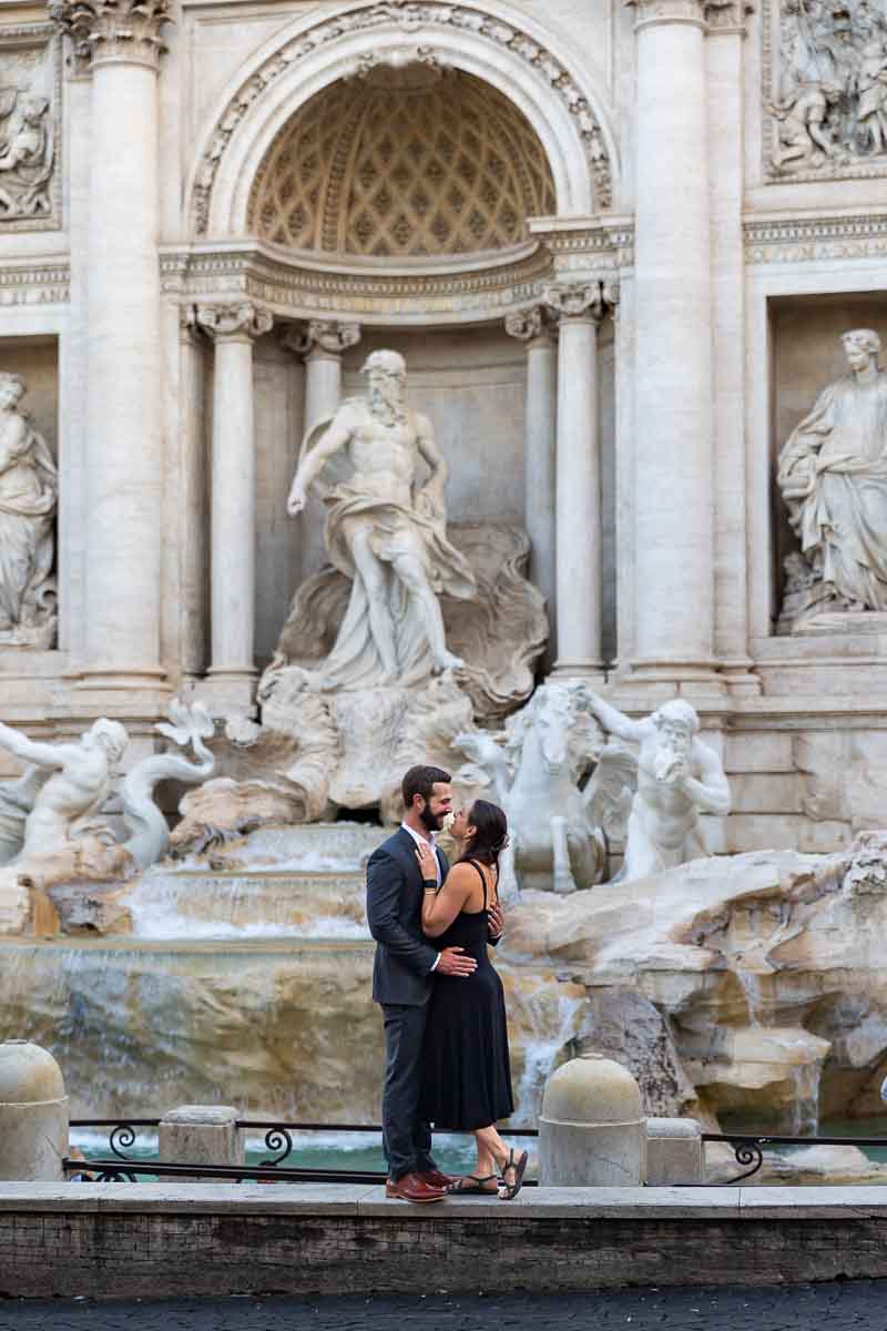 Couple just engaged photographed together at the Trevi fountain in Rome Italy