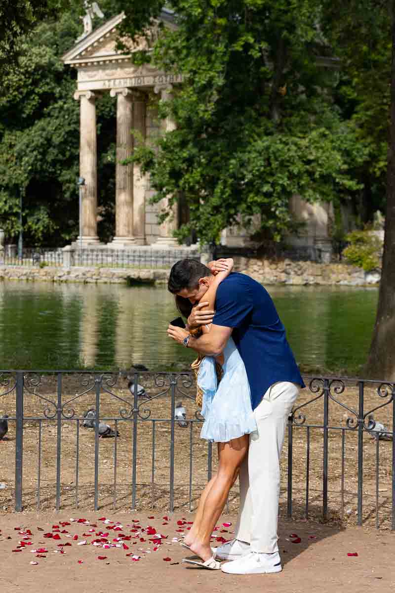 Overwhelming joy and happiness after a Rome proposal candidly photographed at the Villa Borghese lake 