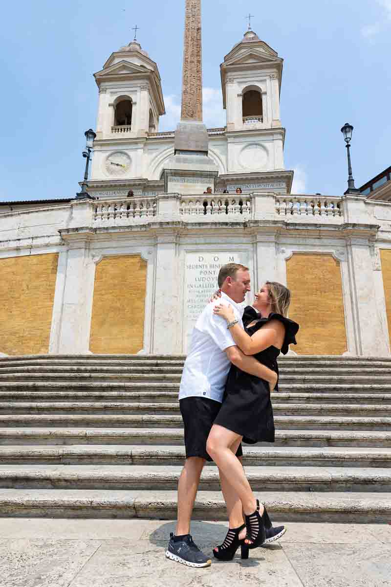 Couple together taking pictures on the Spanish steps 