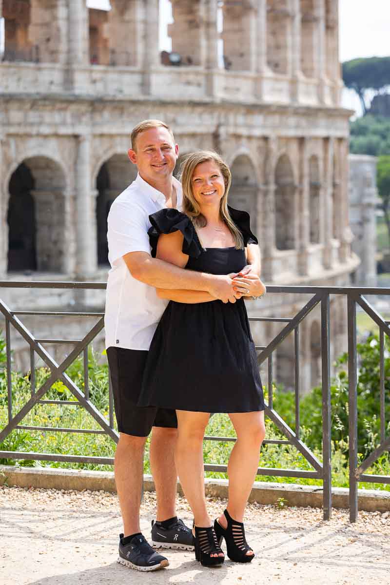 Colosseum couple photo shoot standing in front of the monument on a terrace overlooking from above 