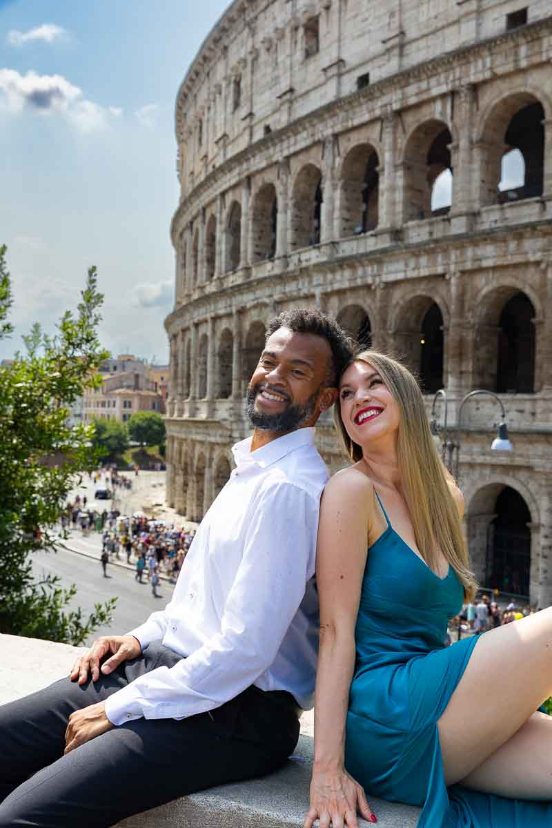 Sitting down taking pictures at the Roman Colosseum while enjoying the photoshoot