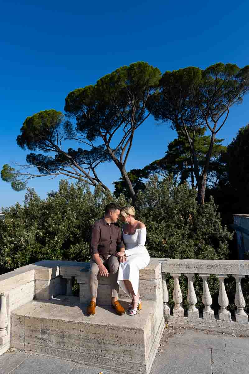 posed portrait taken underneath Mediterranean pine trees 