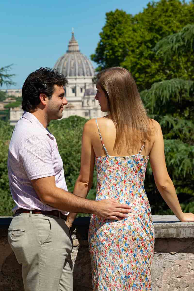 Back view image of a couple taking engagement photos in the Eternal city of Rome