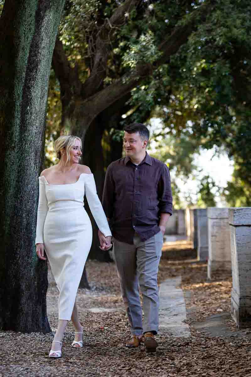 Walking in Rome during an engagement photo shoot in Villa Borghese 