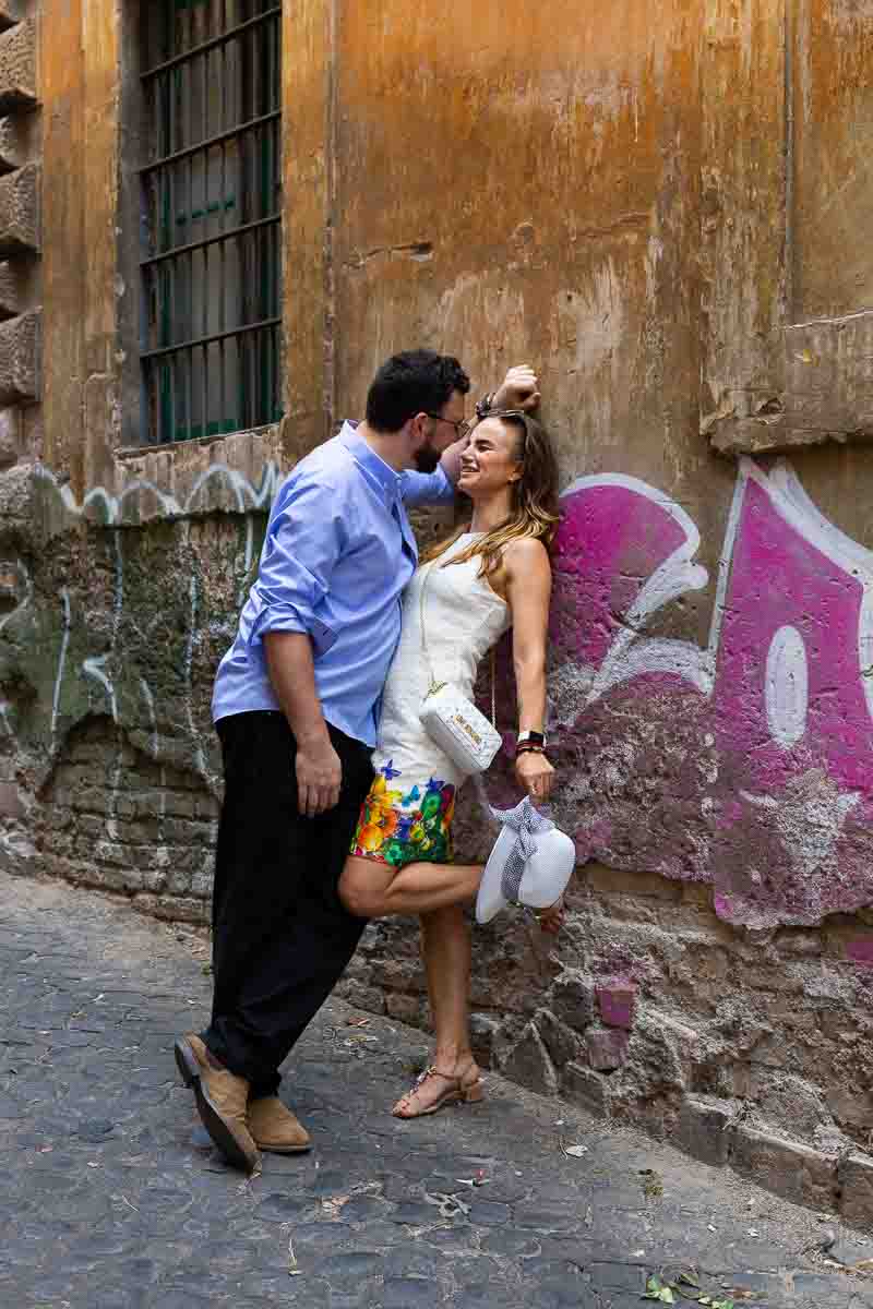 Leaning against a wall on a roman street 