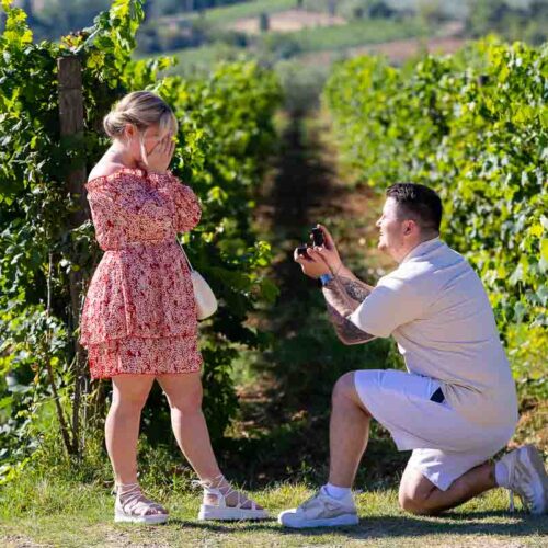 Proposing at the head of the vineyard rows in a knee down position