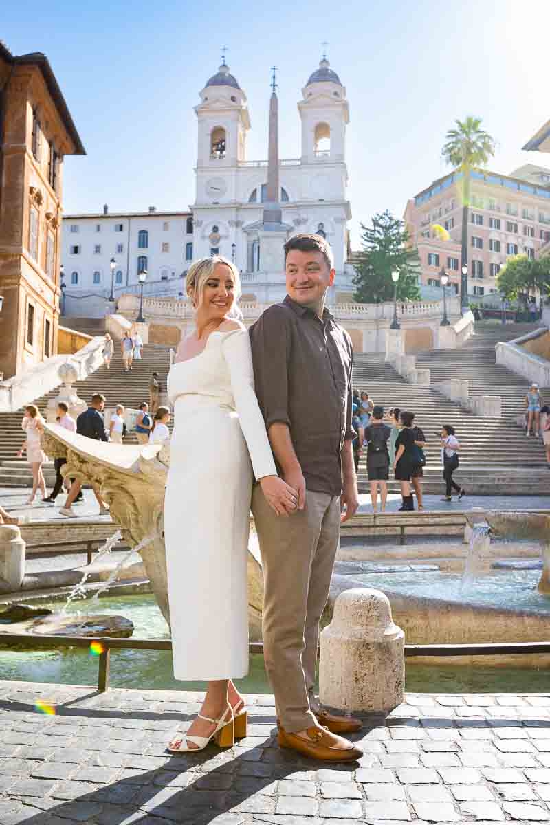 Posing back to back in front of the barcaccia water fountain in front of the Spanish steps 