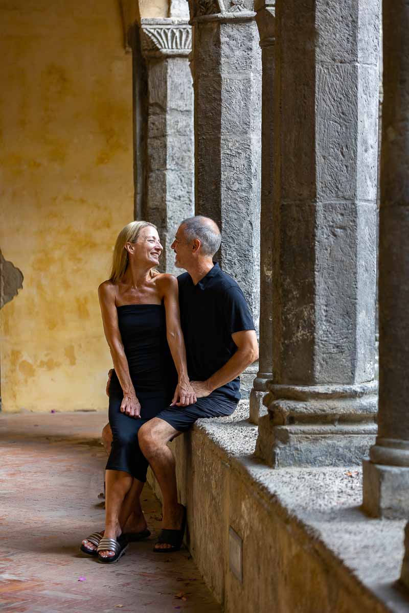 Couple photo shoot sitting down underneath the ancient cloister of Sorrento Italy