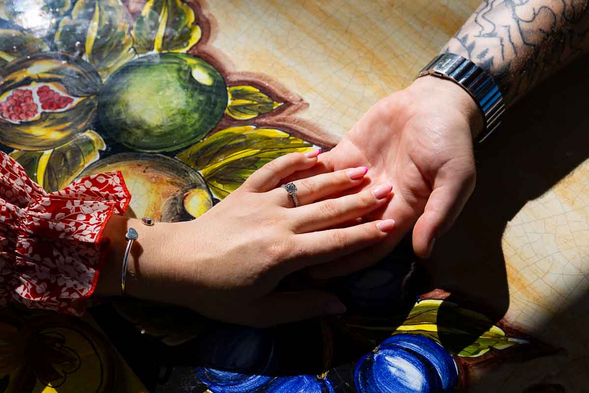 Engagement ring close up picture photographed over typical tuscan ceramic tables 