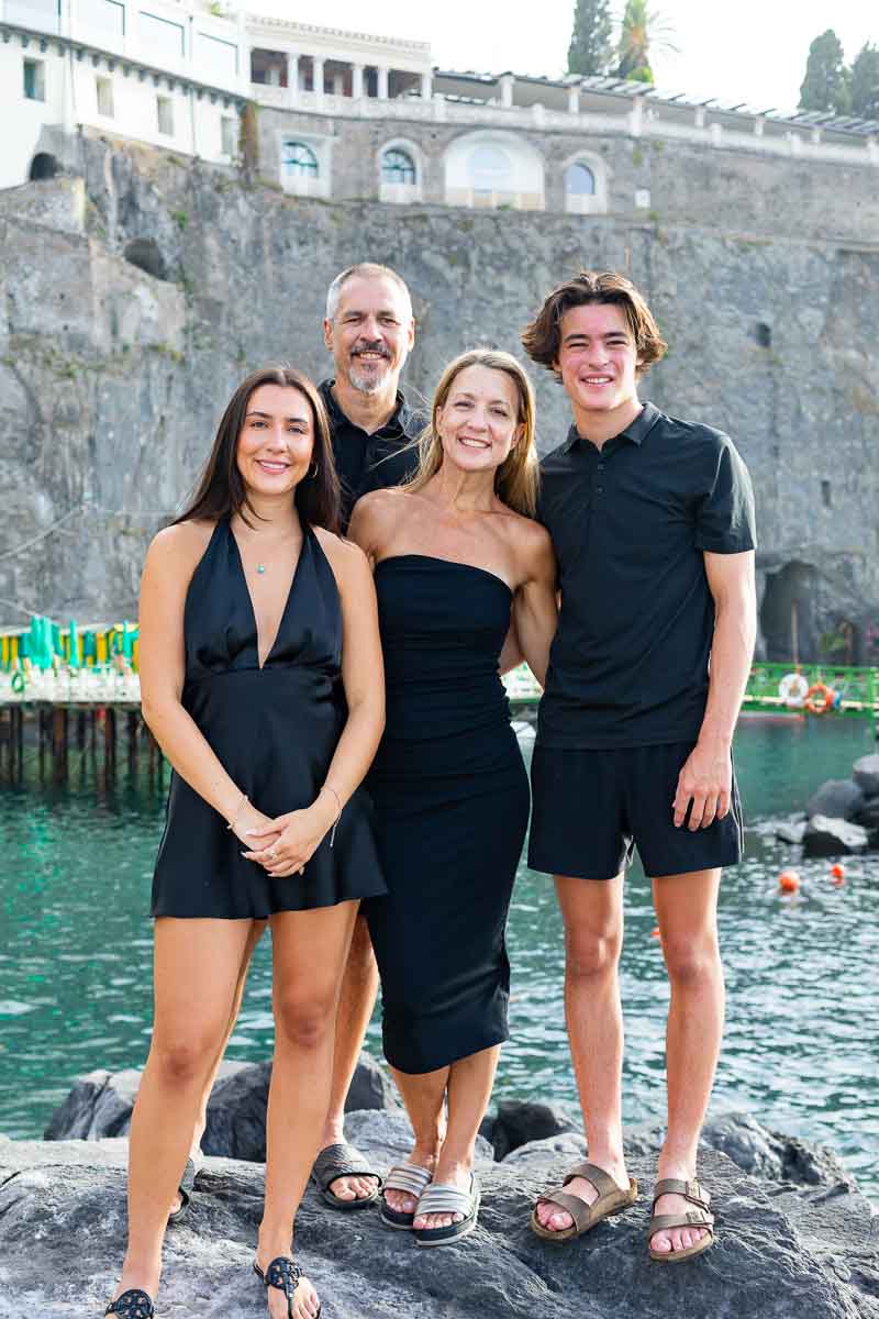 Family portrait picture taken by the seawater in Sorrento 