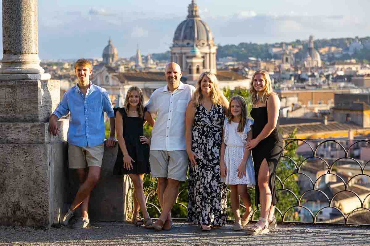 Family photos taken in front of the roman skyline in Rome Italy 