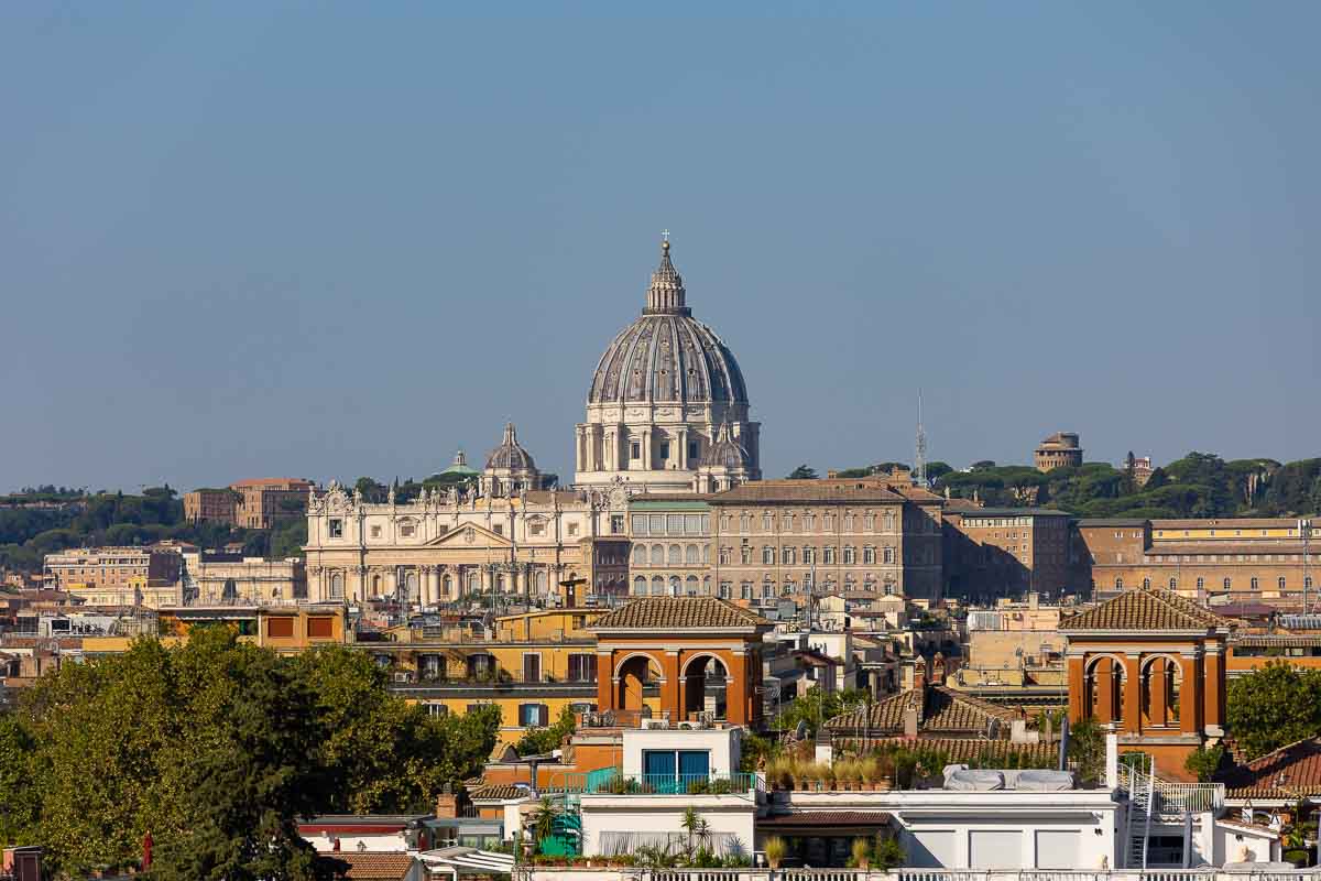 Rome cityscape photographed with Saint Peter's cathedral dome in the far distance from the Vatican 