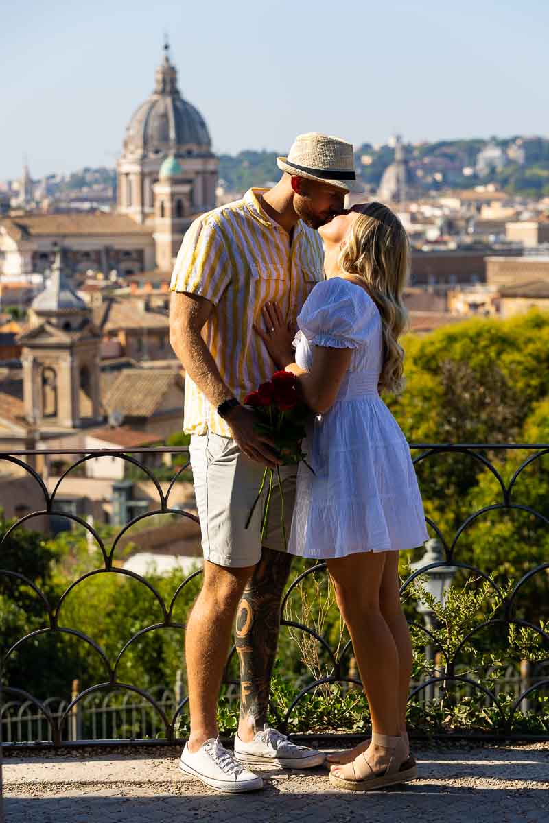 Couple kissing during a photo session at the Pincio park terrace