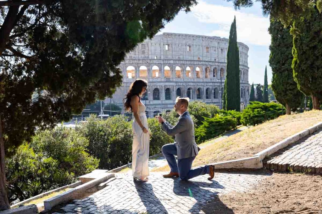 Knee down wedding marriage proposal candidly photographed at the Roman Colosseum at sunset