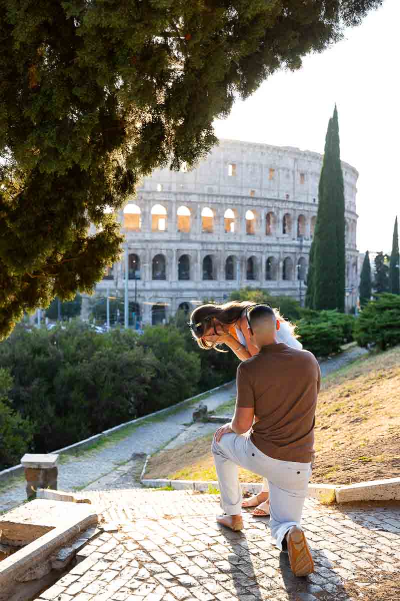 Proposing marriage at the Colosseum during an engagement photoshoot in Rome