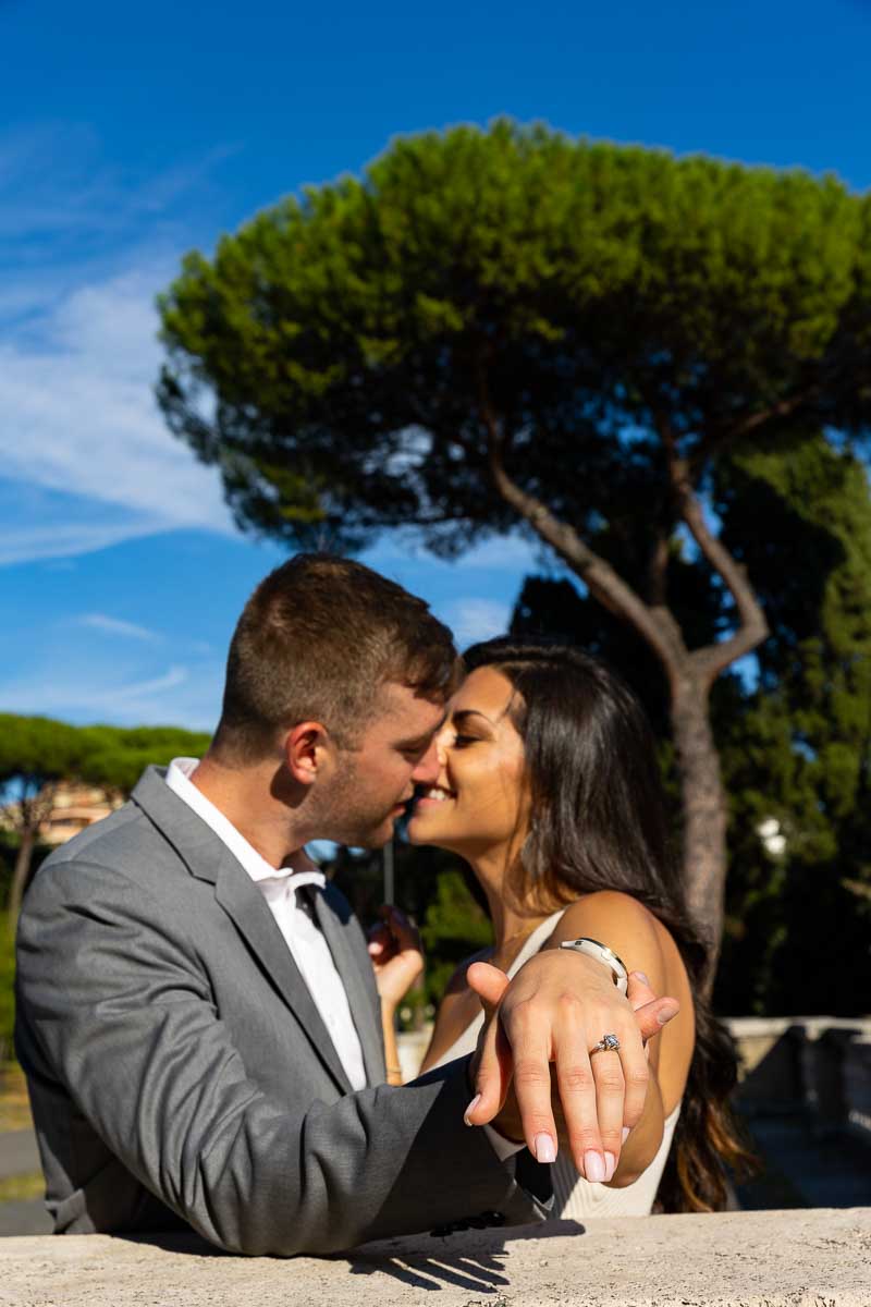 Picture of the engagement ring photographed up close by the a park in Rome Italy