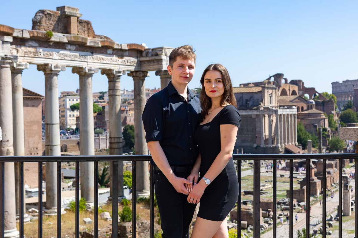 Couple portrait photo shooting in front of the Roman Forum viewed from above 