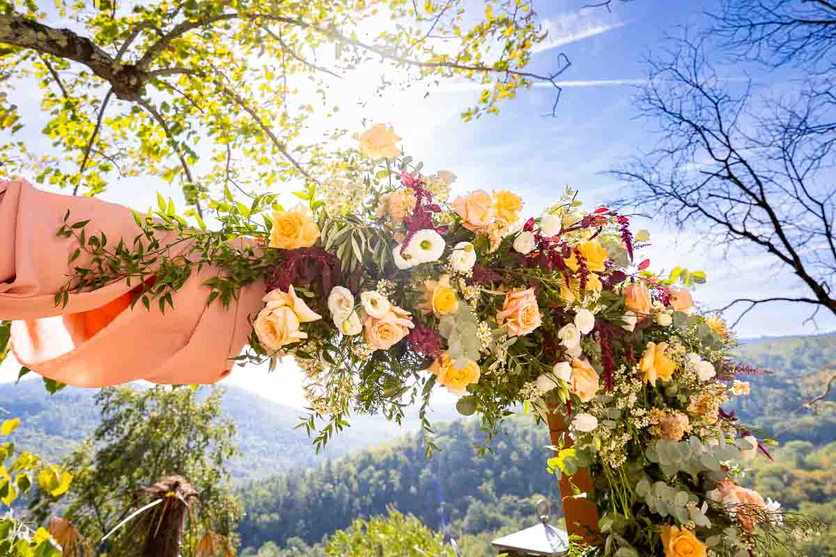 Arc of flowers for the Wedding ceremony in Tuscany Wedding Photography