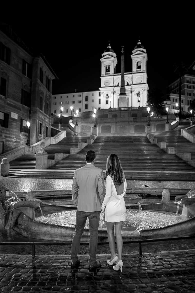 Black and white conversion of a couple looking at the Spanish steps in Rome Italy