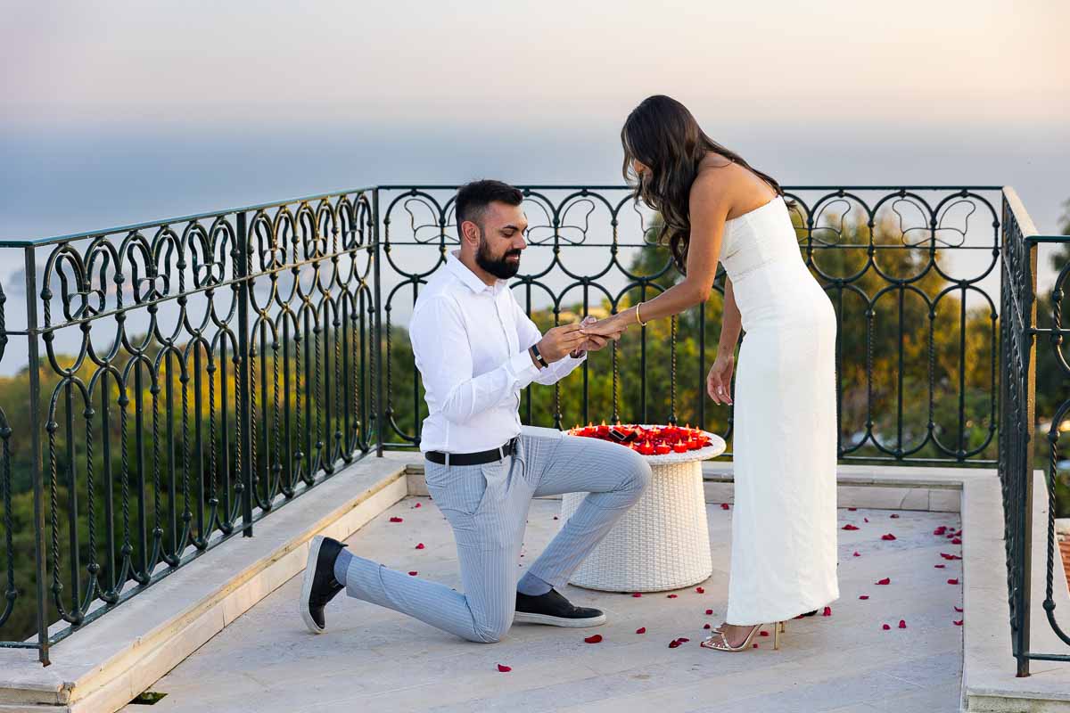 Piano di Sorrento Proposal. Putting the engagement ring on. On a terrace overlooking the Mediterranean sea coast