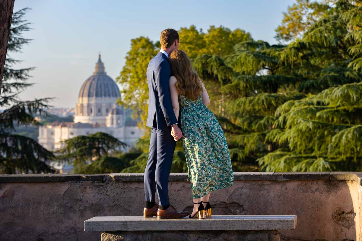 Standing in front of the view of Saint Peter's cathedral in the far distance