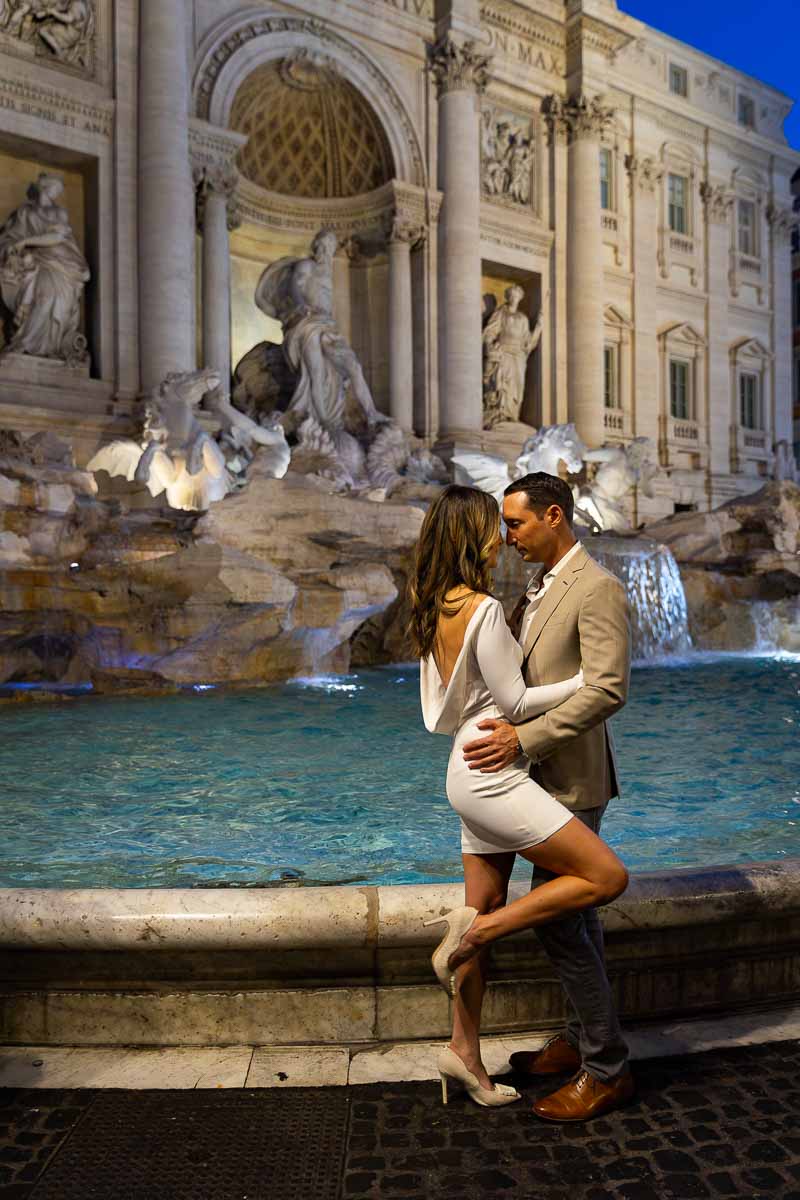 Couple portrait picture taken at the Trevi fountain in Rome Italy