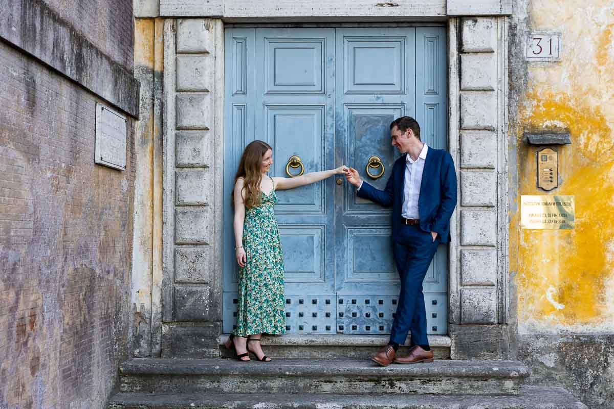 Holding hands during a roman photography session 