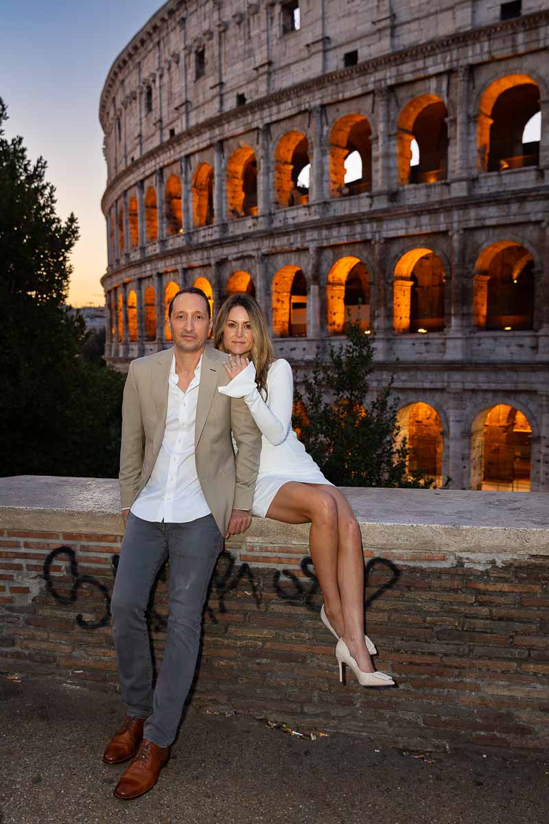 Sitting down in front of the Colosseum during a couple Rome photoshoot