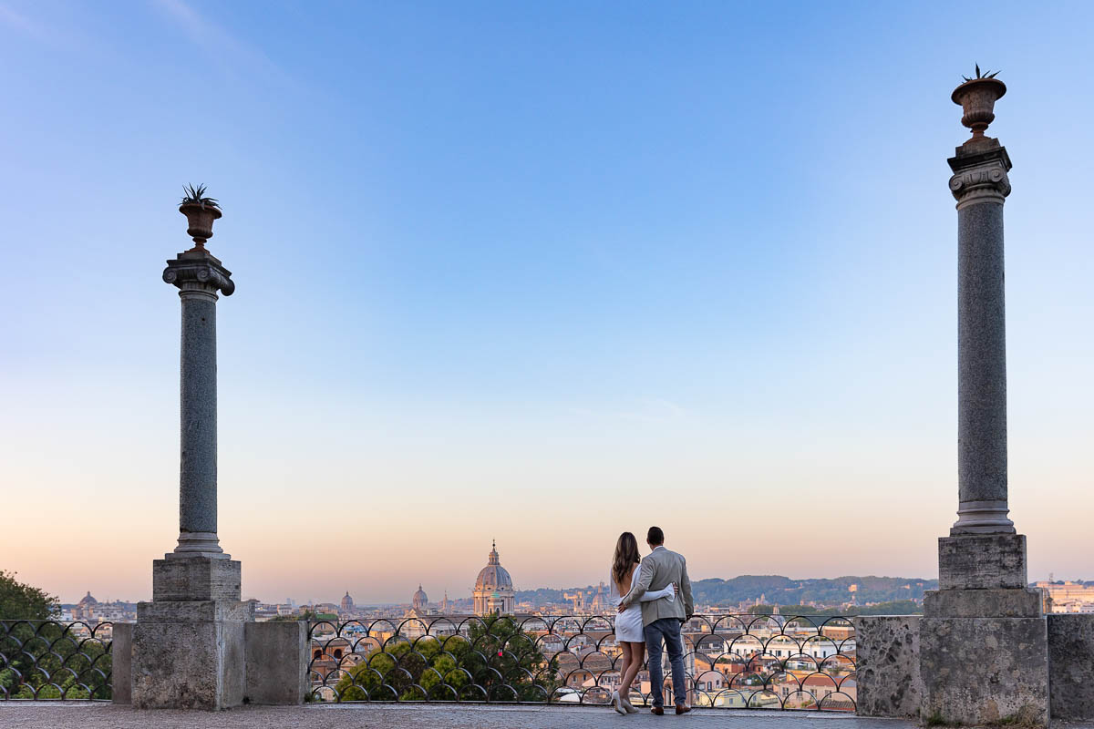 Original color image of a couple at Parco del Pincio looking at the beautiful skyline at sunrise