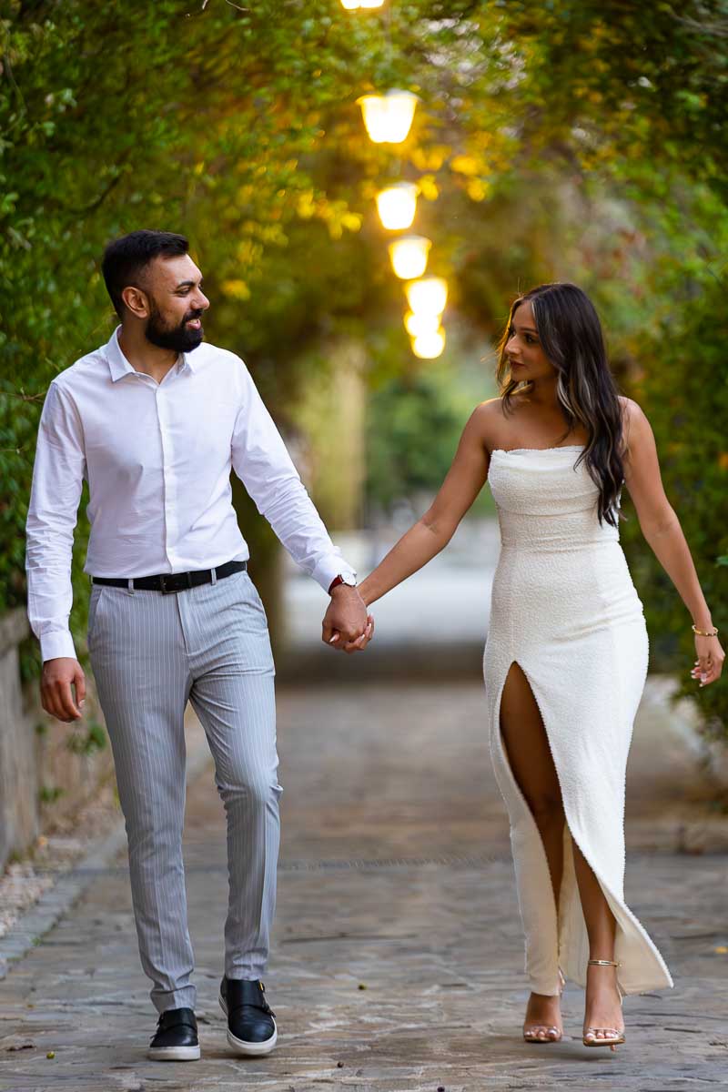 Couple walking together in an illuminated passageway