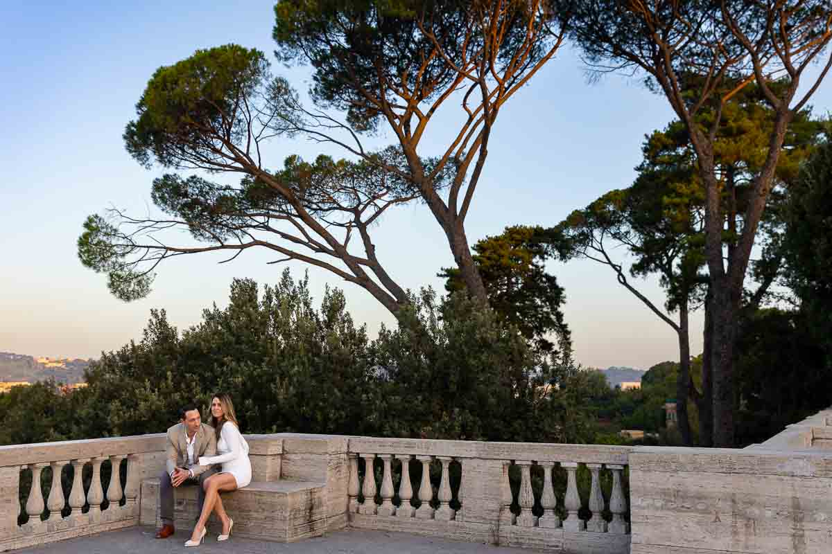 Posed underneath large Mediterranean pine trees in Rome
