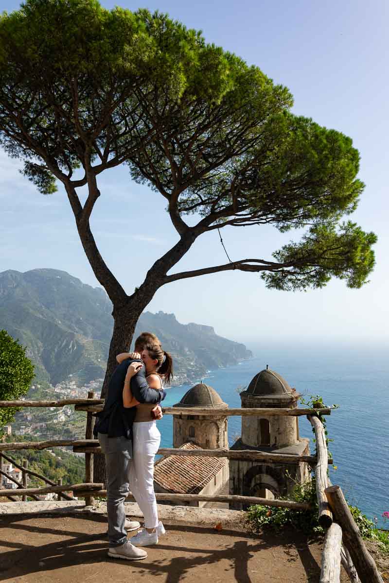The she said yes moment among scenic views over the Amalfi coast and ancient domes and mediterranean pine trees 