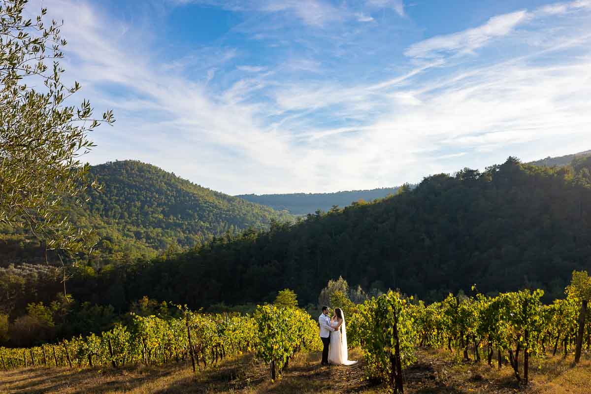 Bride and groom photographed in the Tuscany countryside. Artistic photography. Wedding photographer in Italy