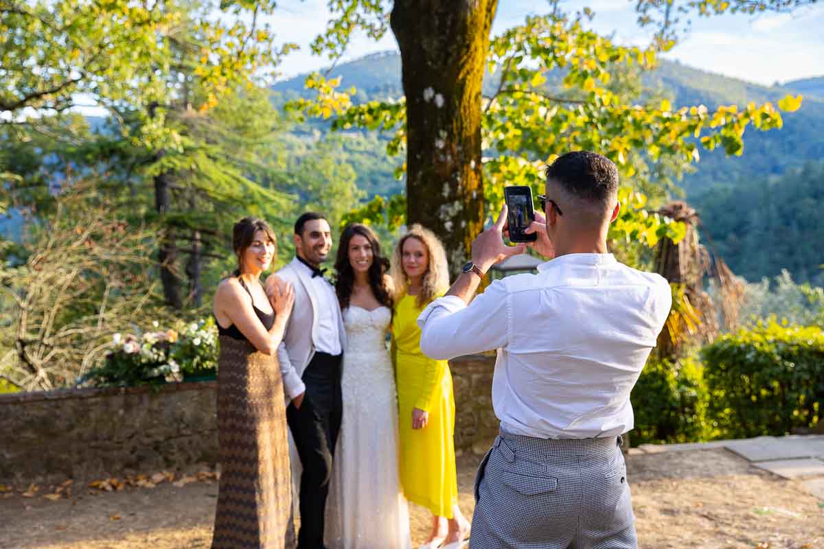 Guests taking pictures of each other on their mobile phones