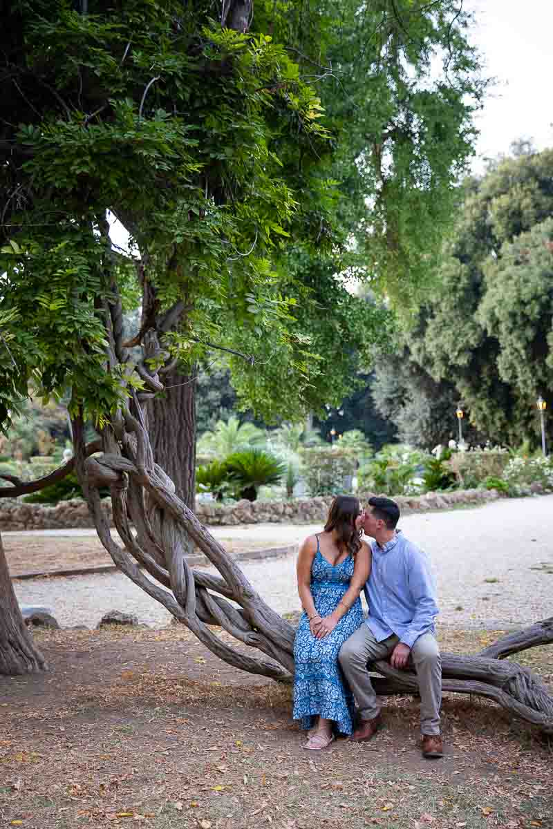 Posed sitting down portrait of a couple photographed during an engagement photography session