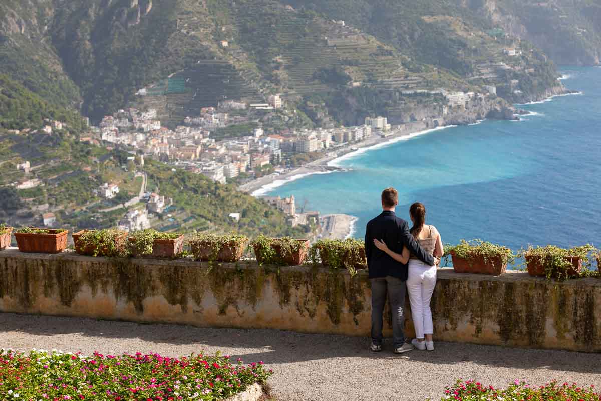 Couple portrait as they are admiring the one of a kind view from the spectacular Ravello's Villa Rufolo 