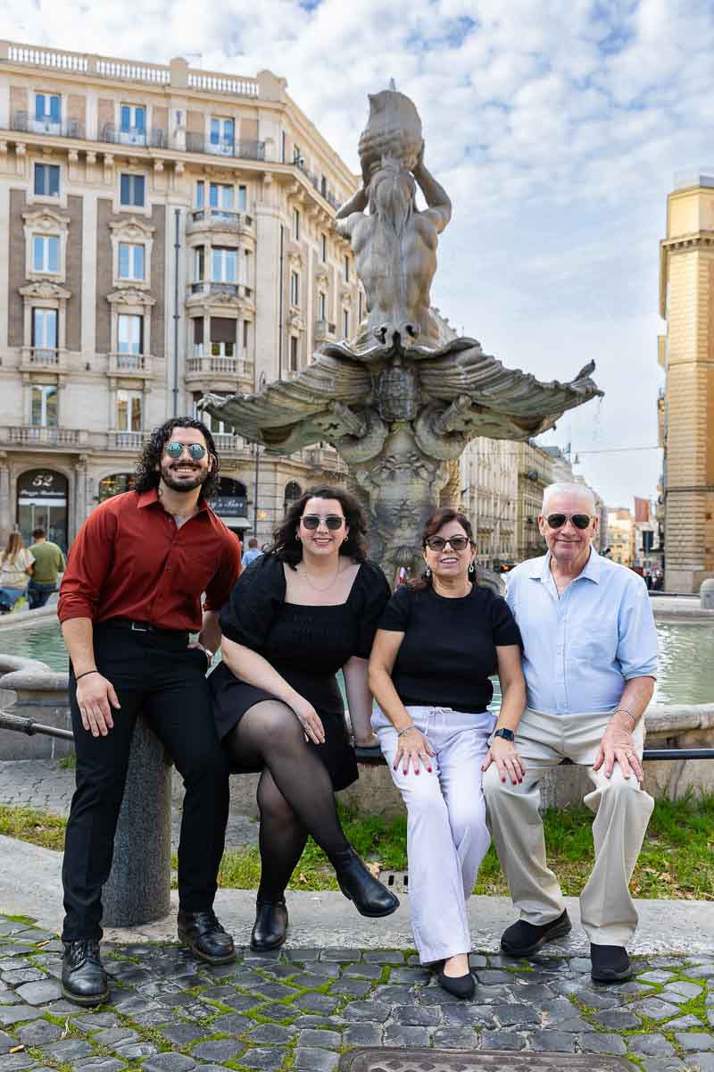 Family photoshoot in Rome Italy posed by the Barberini water fountain