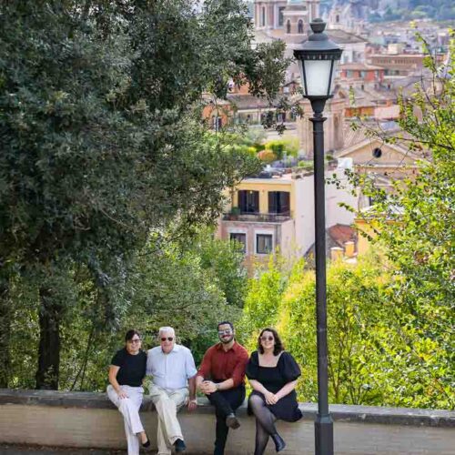 Group family photography frame from above looking below over the roman skyline