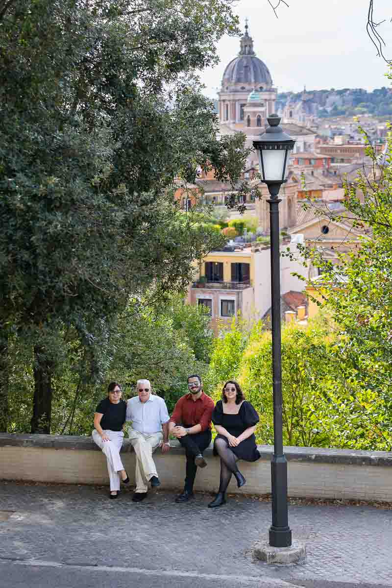 Group family photography frame from above looking below over the roman skyline 