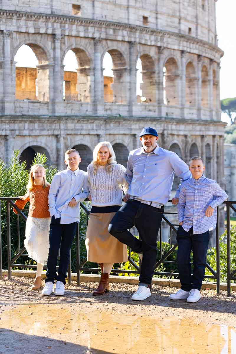 Standing in front of the Colosseum during a family photography session in Rome Italy 
