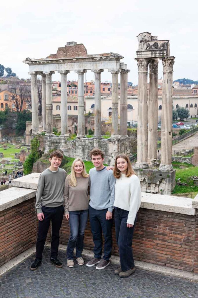 Family portrait pictures taken at the Roman Forum posing down in front of the ancient temples and monuments